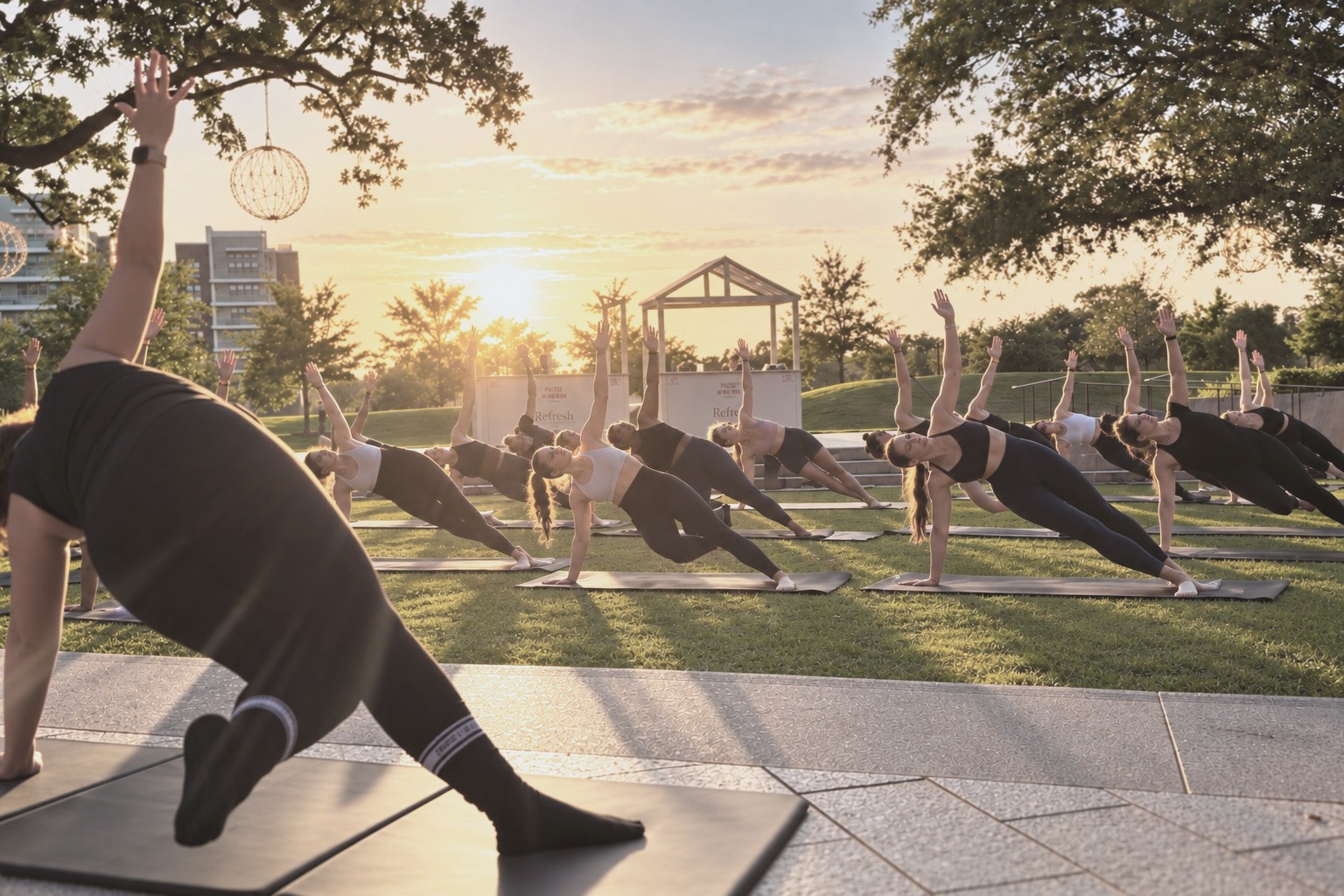 DUO mat class on the lawn at sunset